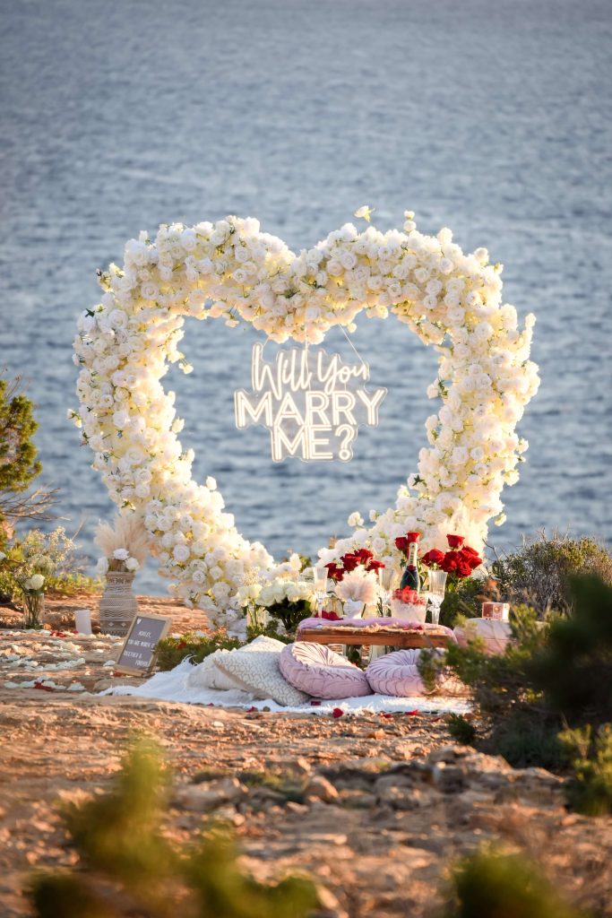 Heart flower arch marriage proposal in Ibiza by Ibiza Secret Picnic